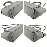 Pre-owned valentino grey leather rockstud trapeze handbag front