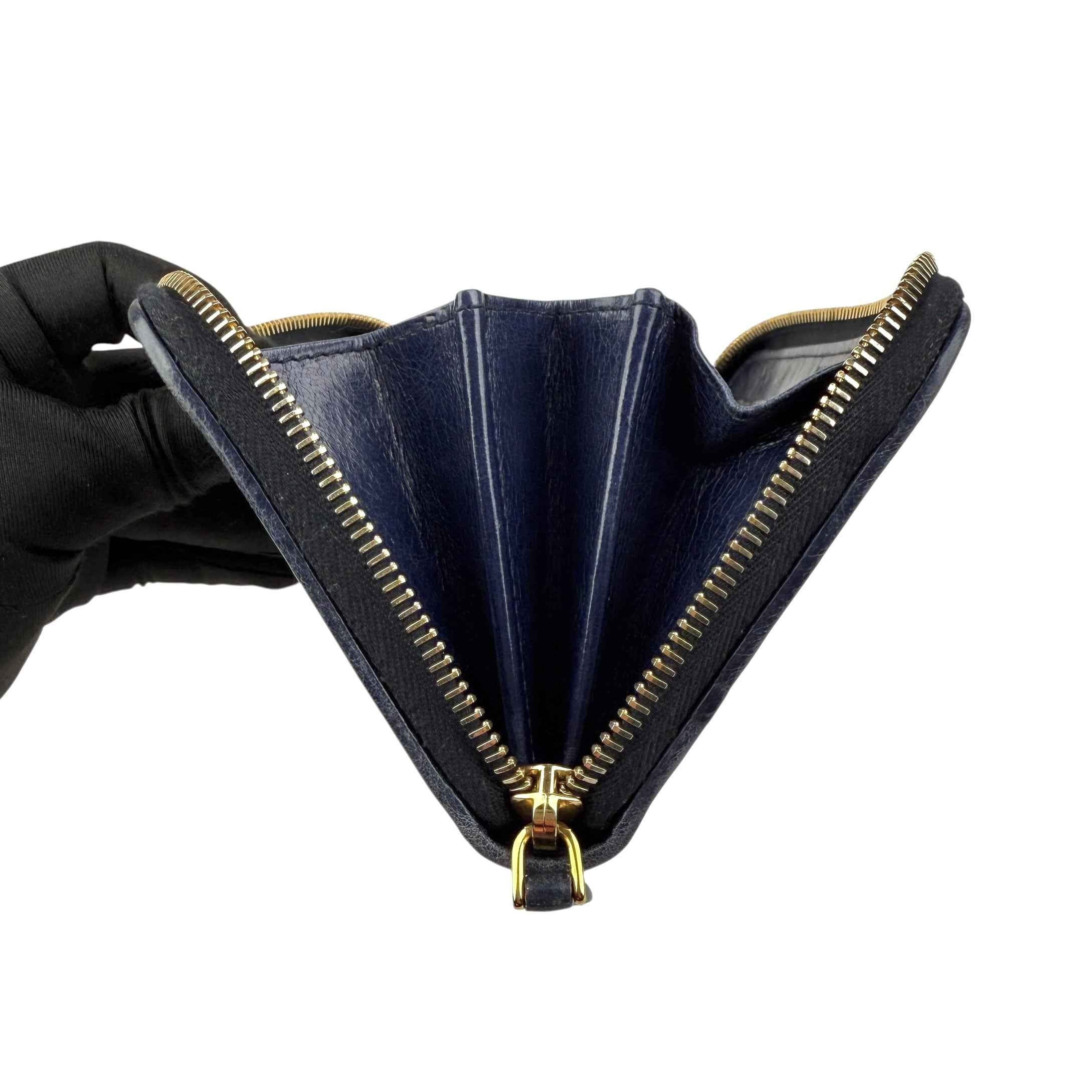 Prada calfskin zip around wallet