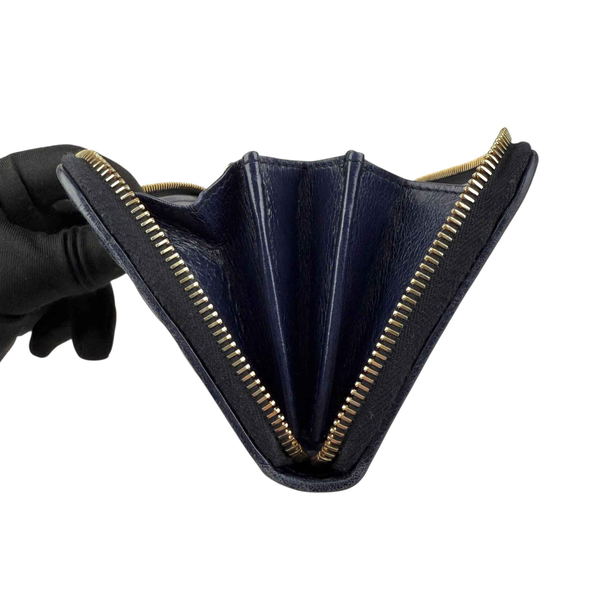 Prada calfskin zip around wallet
