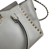 Pre-owned valentino grey leather rockstud trapeze handbag front
