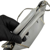 Pre-owned valentino grey leather rockstud trapeze handbag front